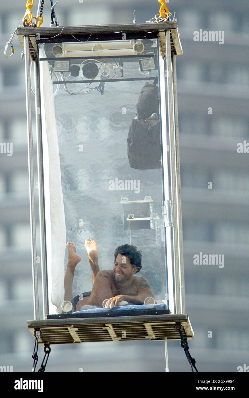 David Blaine continues his stay in a glass box near Tower Bridge in London  Stock Photo - Alamy