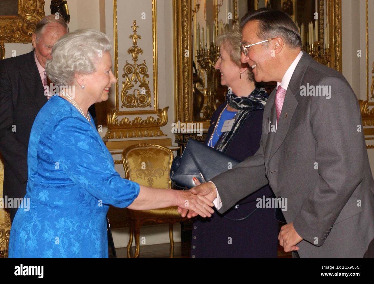 Queen Elizabeth II greets inventor and exporter of level crossings, Peter Coates-Smith at a reception at Buckingham Palace, London,  which aims to pay tribute to more than 400 pioneers of British Life. Â©Anwar Hussein/allactiondigital.com  Stock Photo