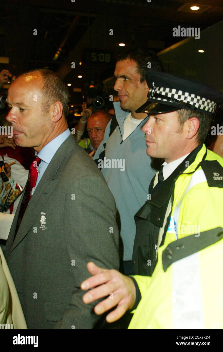 Clive Woodward and Martin Johnson arrive at Heathrow Airport Stock