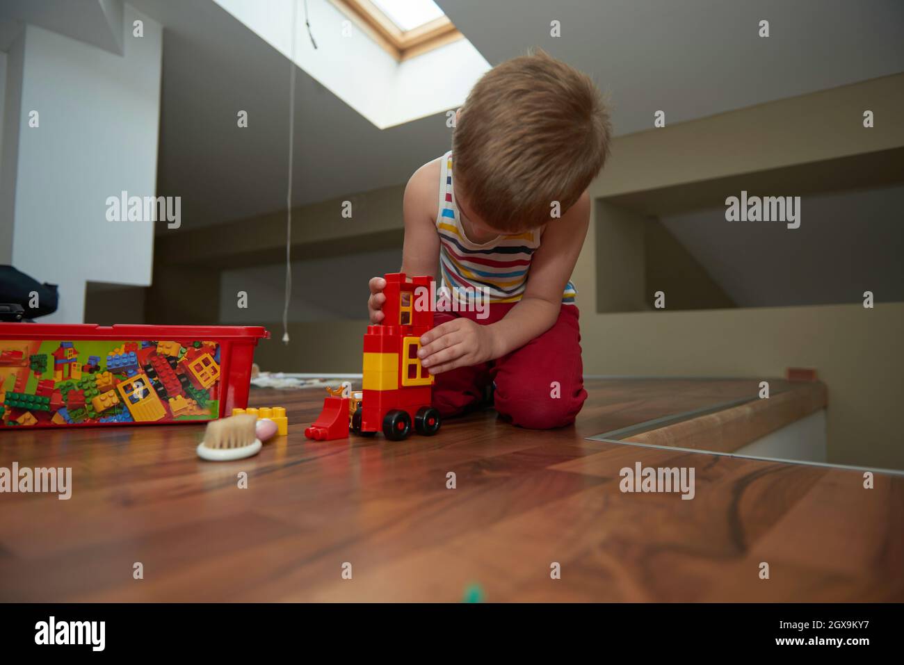Little boy child playing with creative plastic toys indoor, building ...