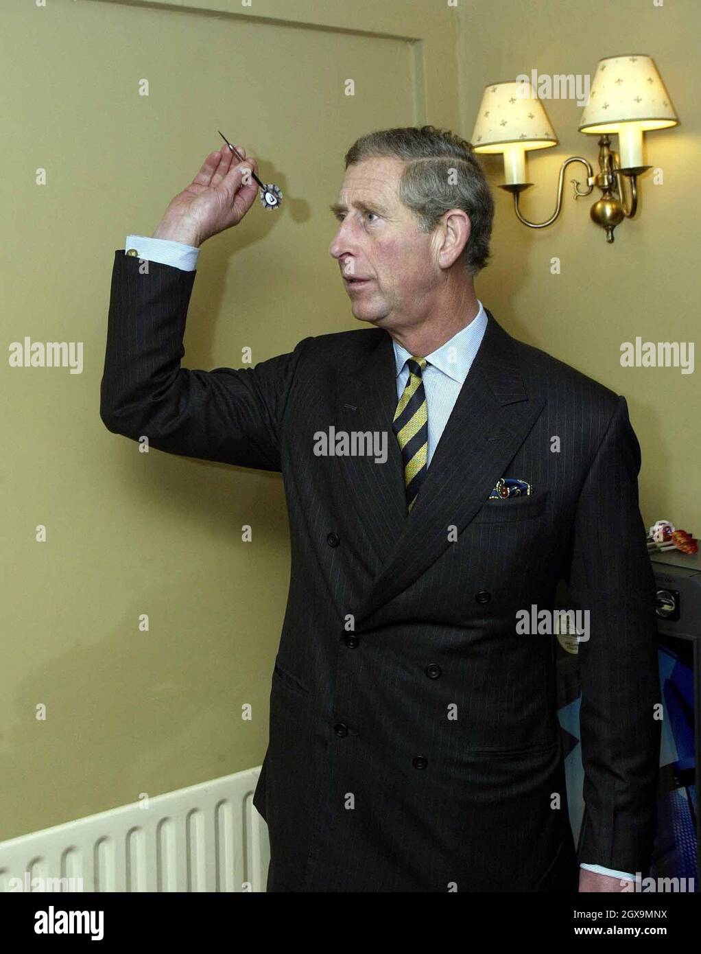 The Prince of Wales enjoyed a sip of a 14-year-old Oban malt whisky during a visit to the Dykes End pub in Reach, Cambridgeshire. Prince Charles enjoyed a game of darts and a whisky after popping into a pioneering village pub,  to meet locals who had saved the business from closing.  Â©Anwar Hussein/allactiondigital.com  Stock Photo