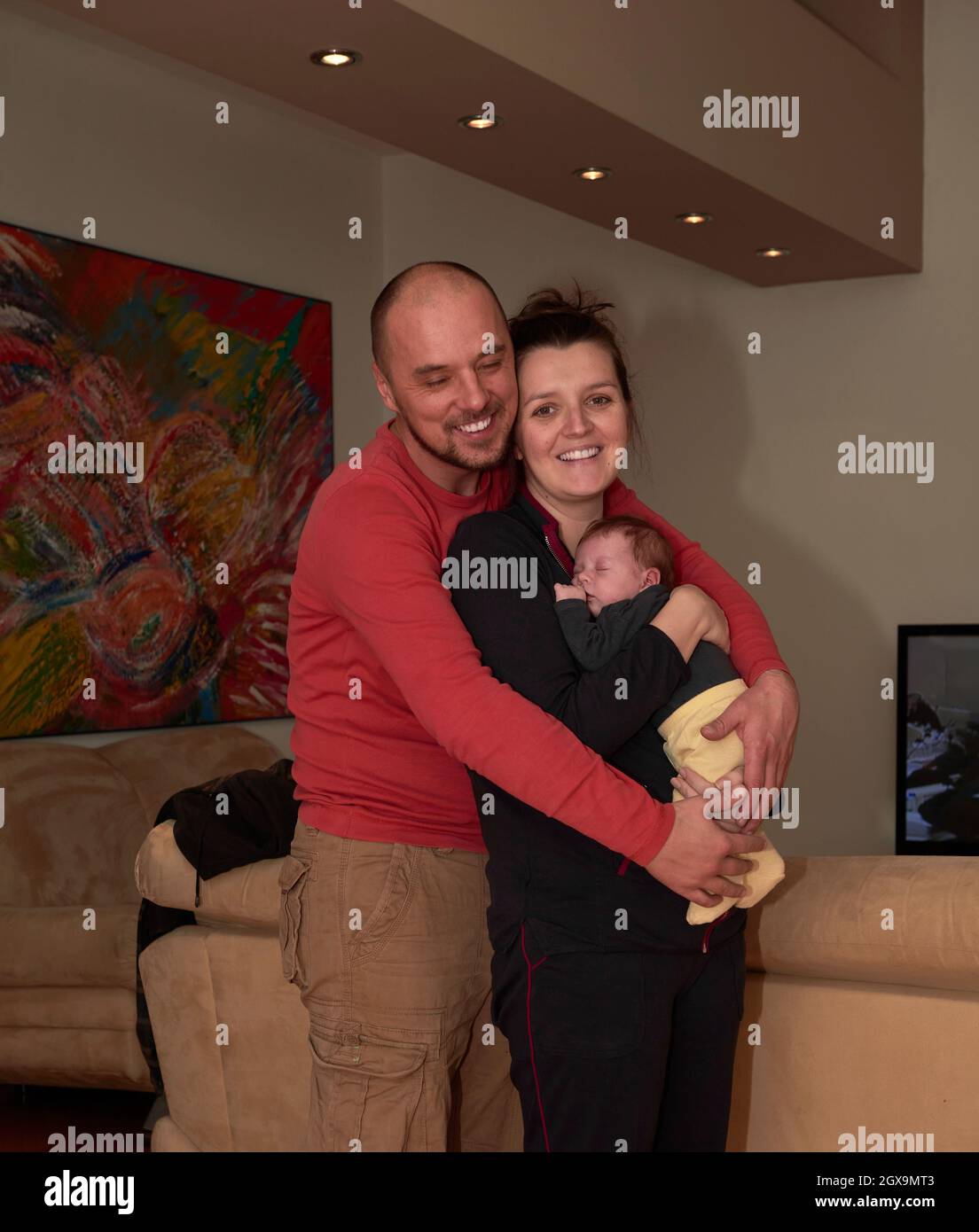 New young family portrait with newborn baby at home stock photo alamy