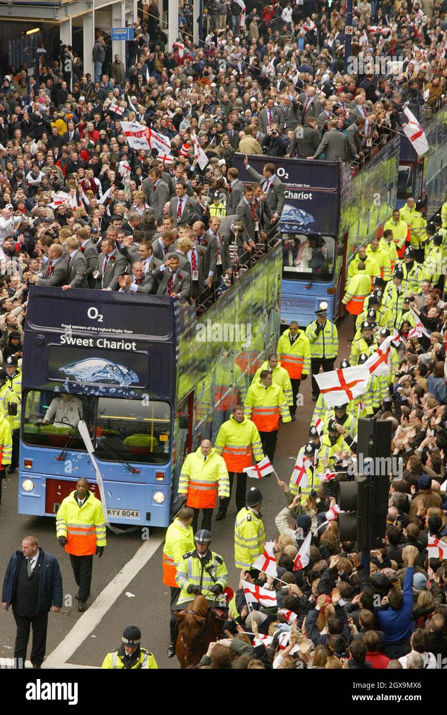 The England rugby team bus makes its way through the thousands of