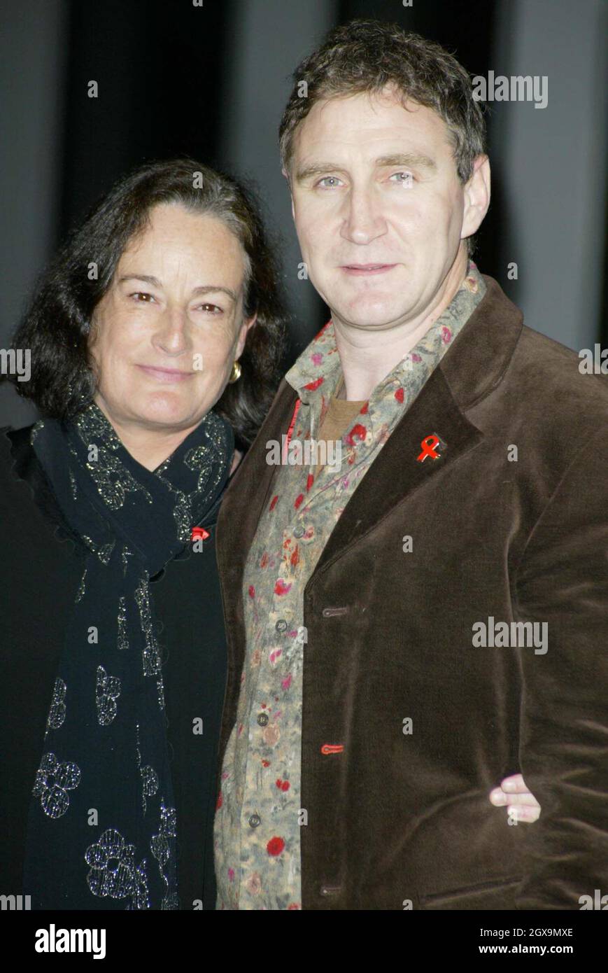 Caroline Guiness and husband Mark McGann turned up to listen to a lecture  on AIDS, which was held on World AIDS Day at City Hall in London Stock  Photo - Alamy