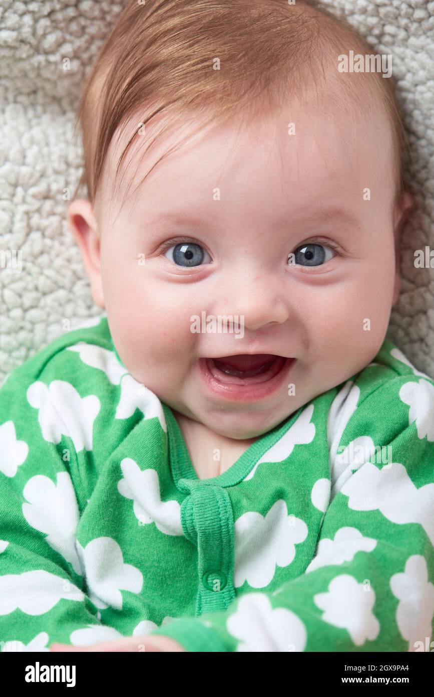 cute little baby playing with hand and smiling with no teeth funny smile  Stock Photo - Alamy