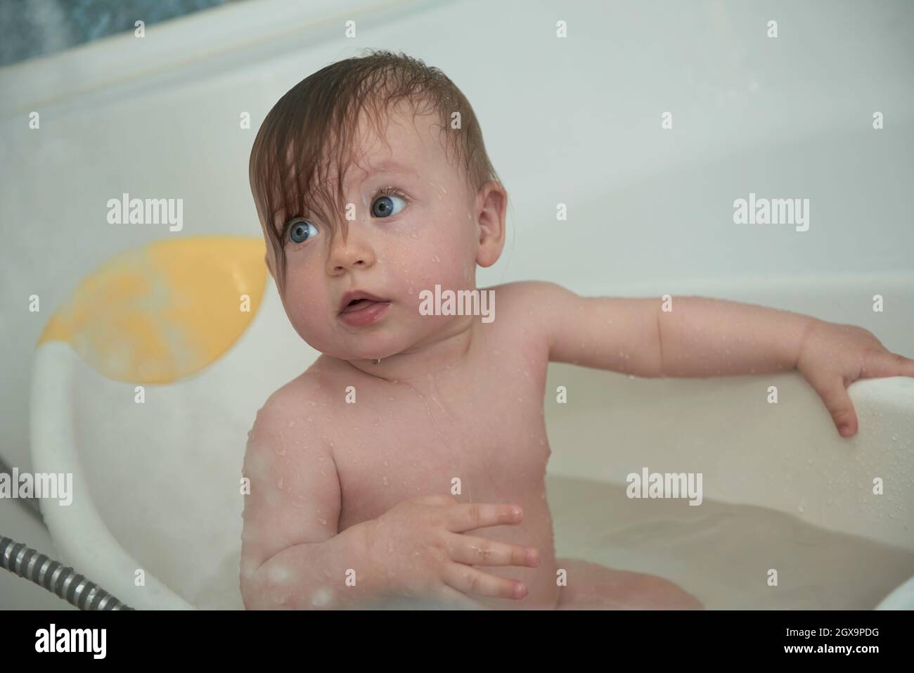 Mother is bathing happy little baby girl taking a bath Stock Photo Alamy