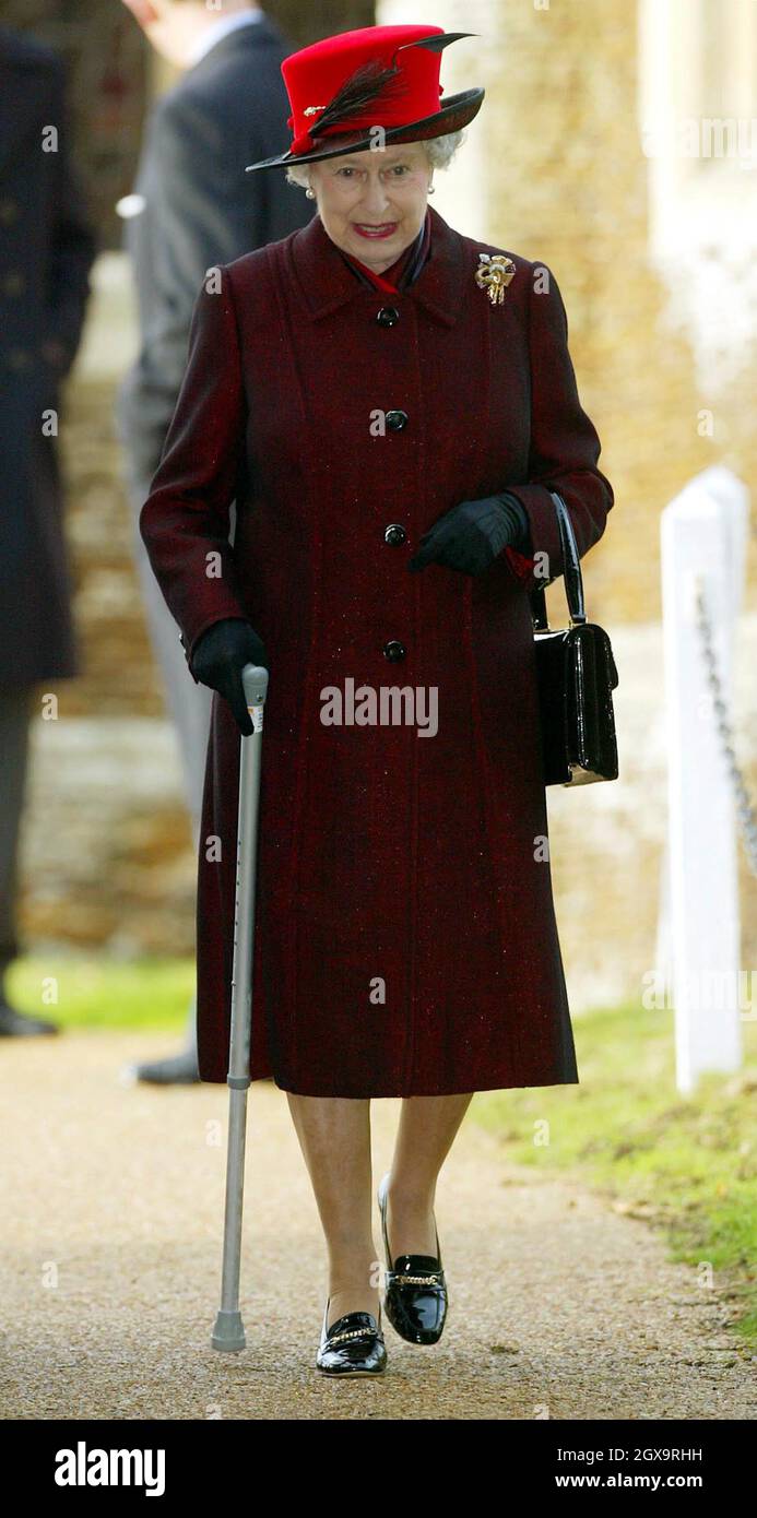 Britain's Queen Elizabeth II arrives at the church of St. Mary Magdalene,  Sandringham, for Christmas service, after arriving by car. Queen Elizabeth  II carries a walking stick following an operation on her