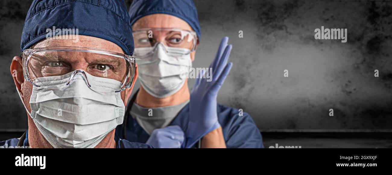 Female and Male Doctors or Nurses Wearing Scrubs and Protective Mask