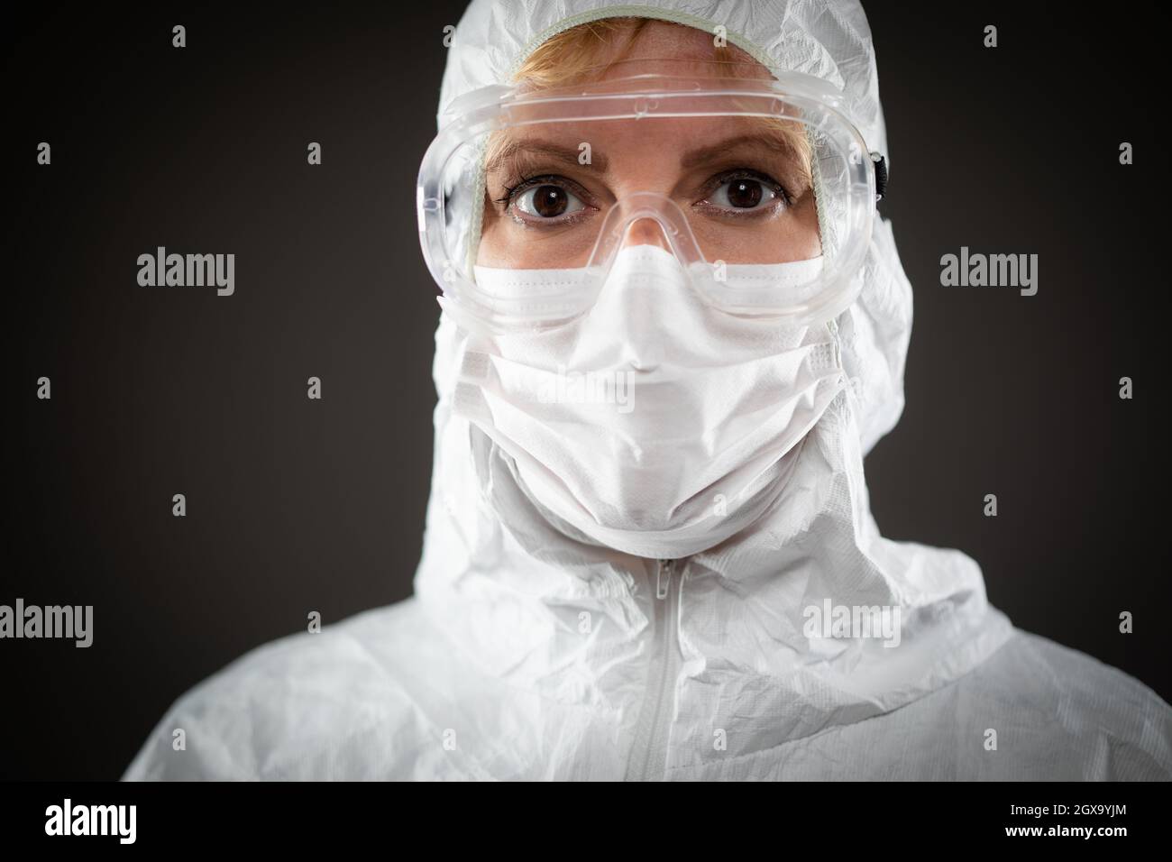 Female Medical Worker Wearing Protective Face Mask and Gear Against ...