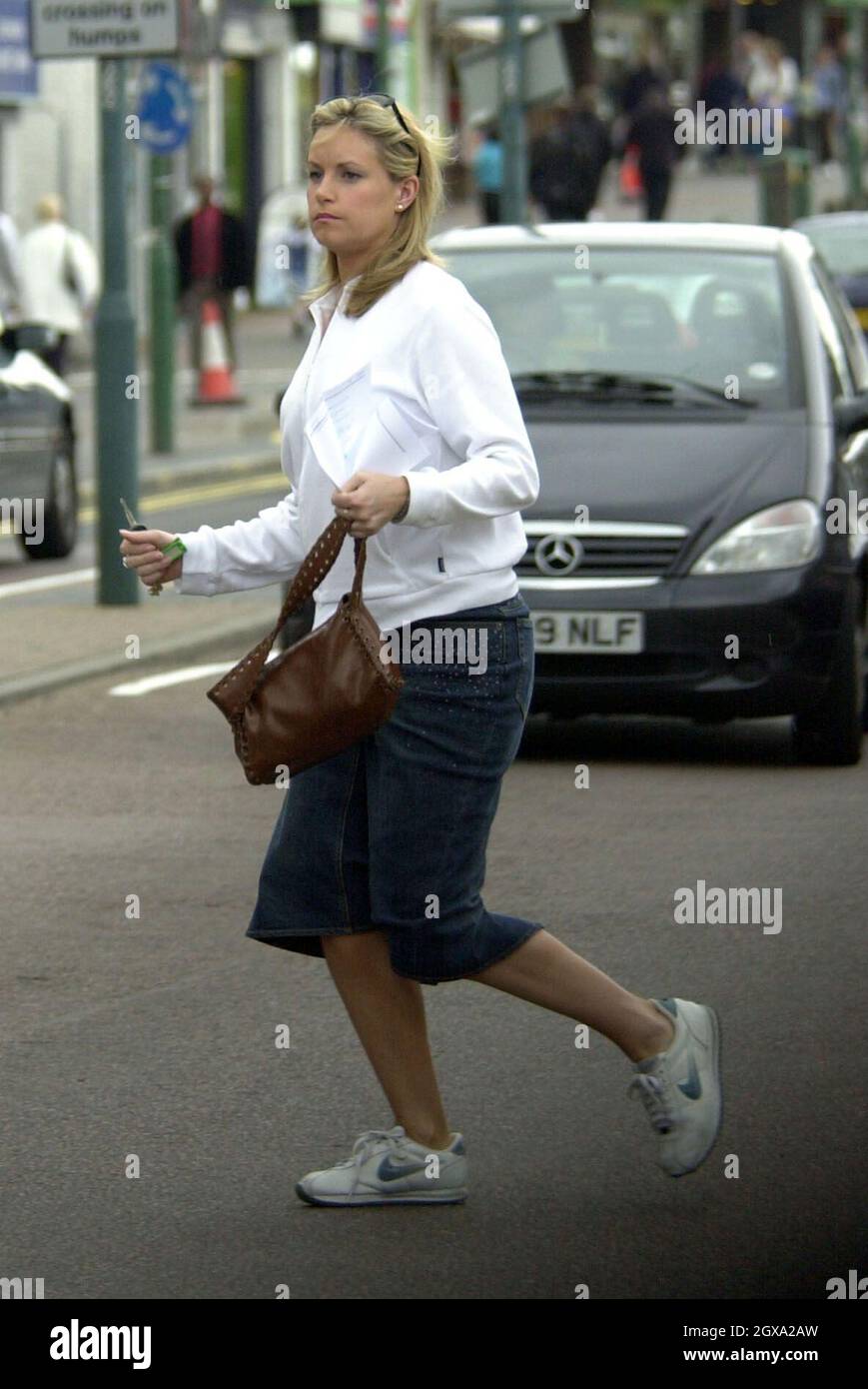 Eastenders new girl Kim Medcalf appears to be floating across the road she joined a friend for lunch at a Pizza restaurant.  Stock Photo