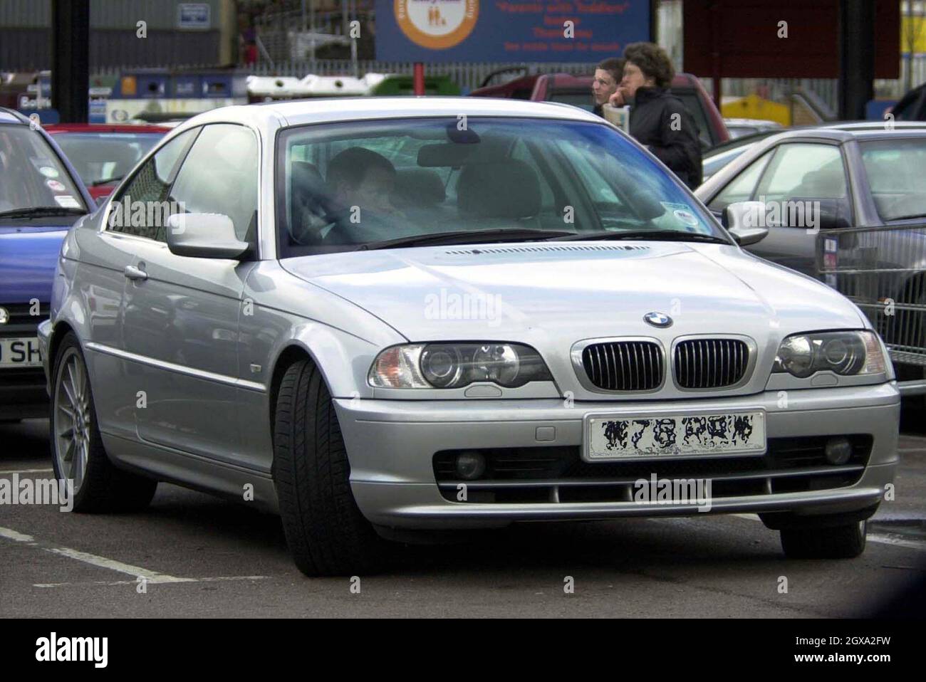 Eastenders star Chip Shop owner Ian Beale , Adam Woodyatt seen driving a flash BMW and shoppig in Tesco's in Hertfordshire  Stock Photo