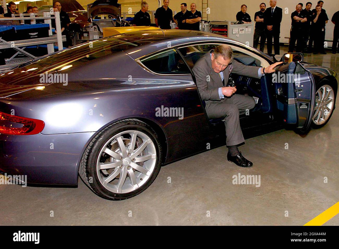 Prince Charles visits the Aston Martin factory at Gaydon Warwickshire, where he met production workers. One of the workers, Andrew McCarthy, displayed his tattoos to which Charles remarked his admiration for such a design.      Stock Photo