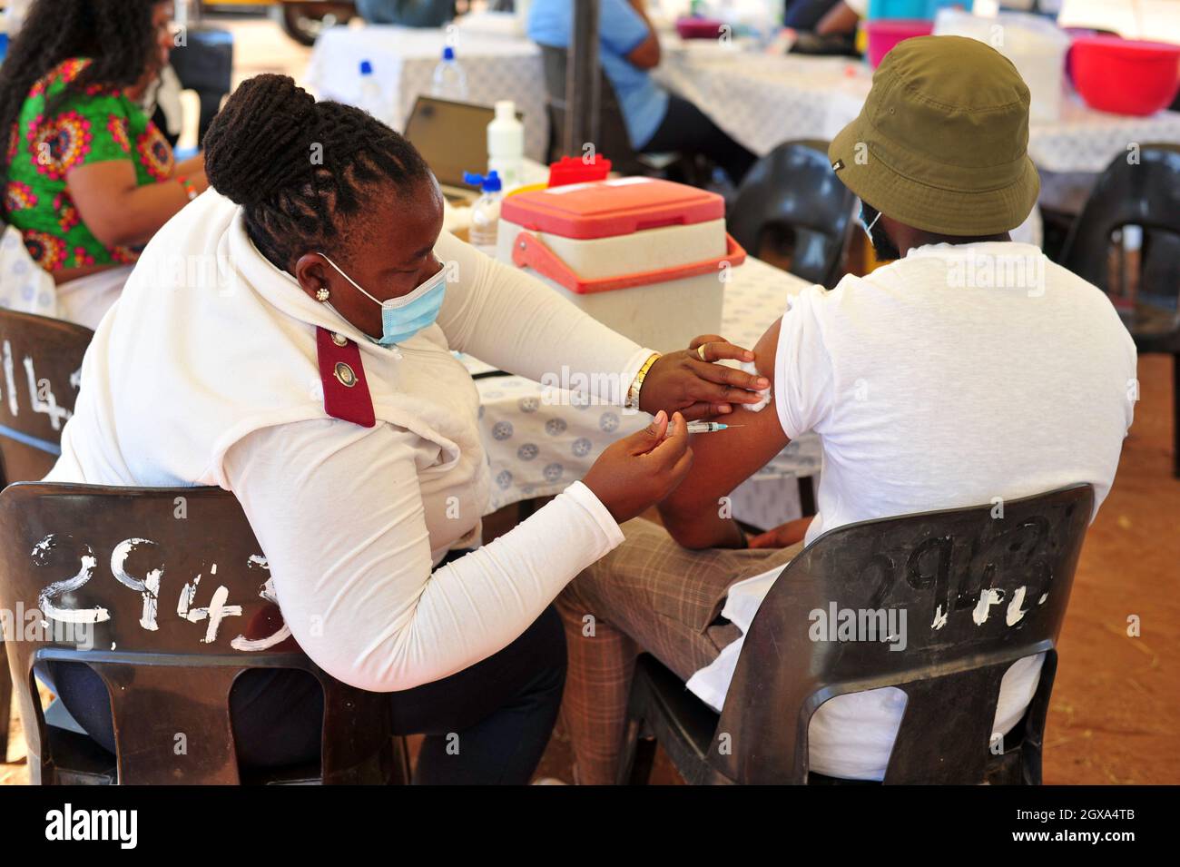 Medical staff vaccinate citizens for covid-19 at a makeshift vaccination site in Moletjie a rural village in Limpopo, South Africa Stock Photo