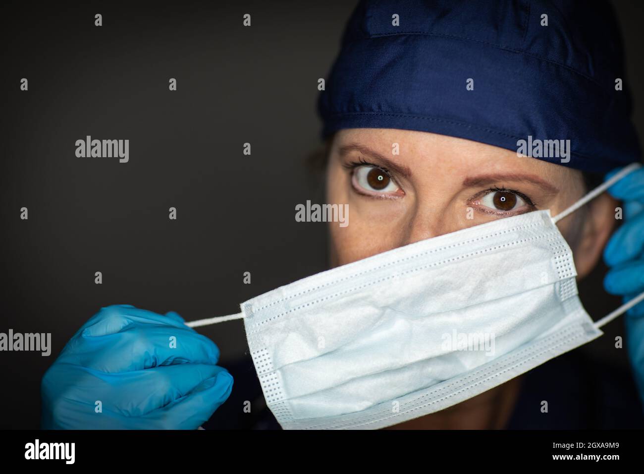 Female Doctor or Nurse Wearing Surgical Gloves Putting On Medical Face ...