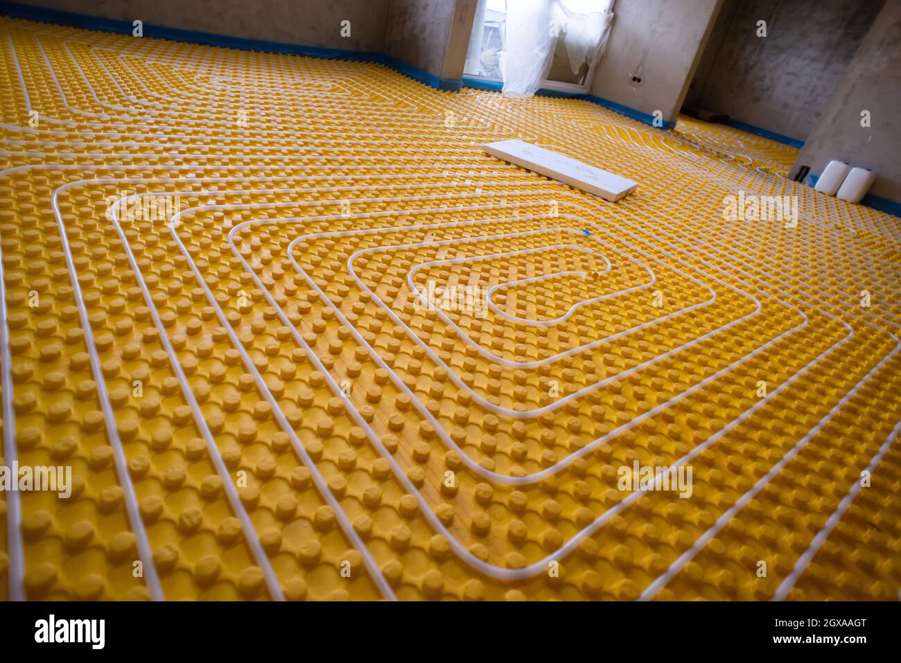 yellow underfloor heating installation with white polyethylene pipes on ... - Penthouse Apartment With Underfloor Heating Installation