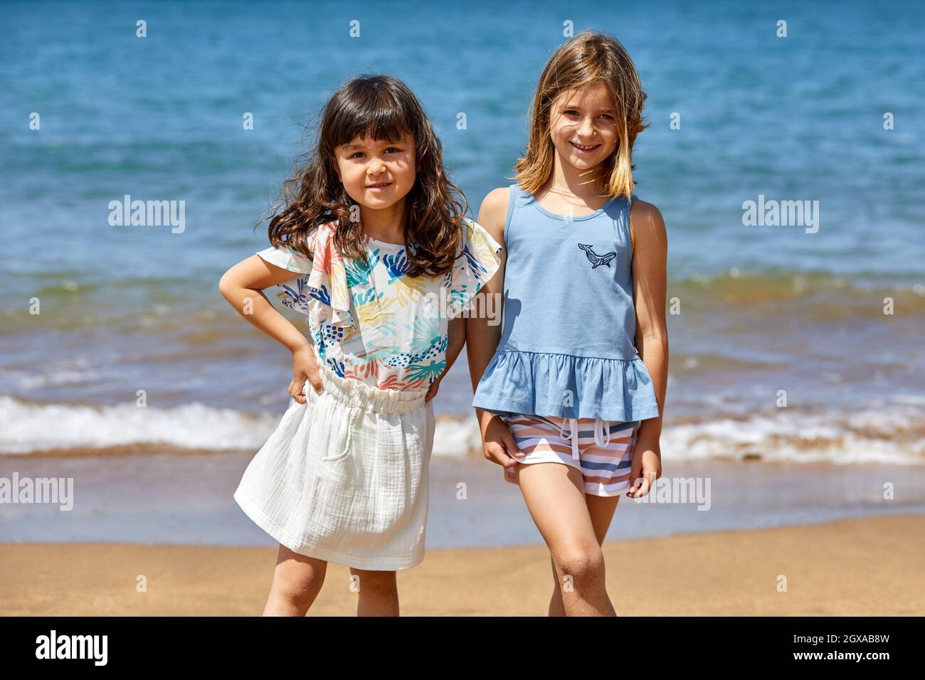 Girls 5-10 years old, Walking on the beach, Zumaia, Gipuzkoa, Basque Country, Spain Stock Photo
