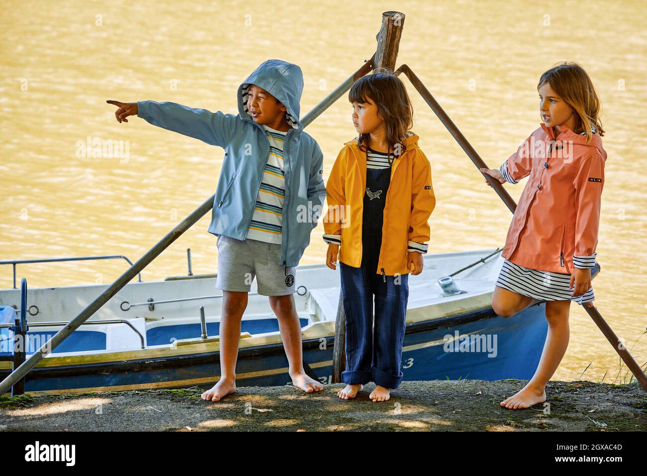 Children 5-10 years on the jetty, Zumaia, Gipuzkoa, Basque Country, Spain Stock Photo