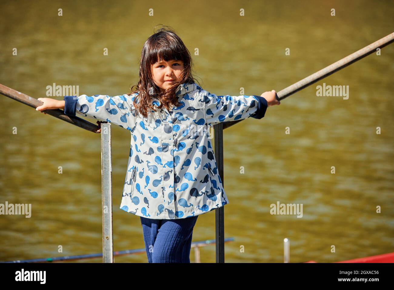 Girl 5-10 years on the jetty, Zumaia, Gipuzkoa, Basque Country, Spain Stock Photo