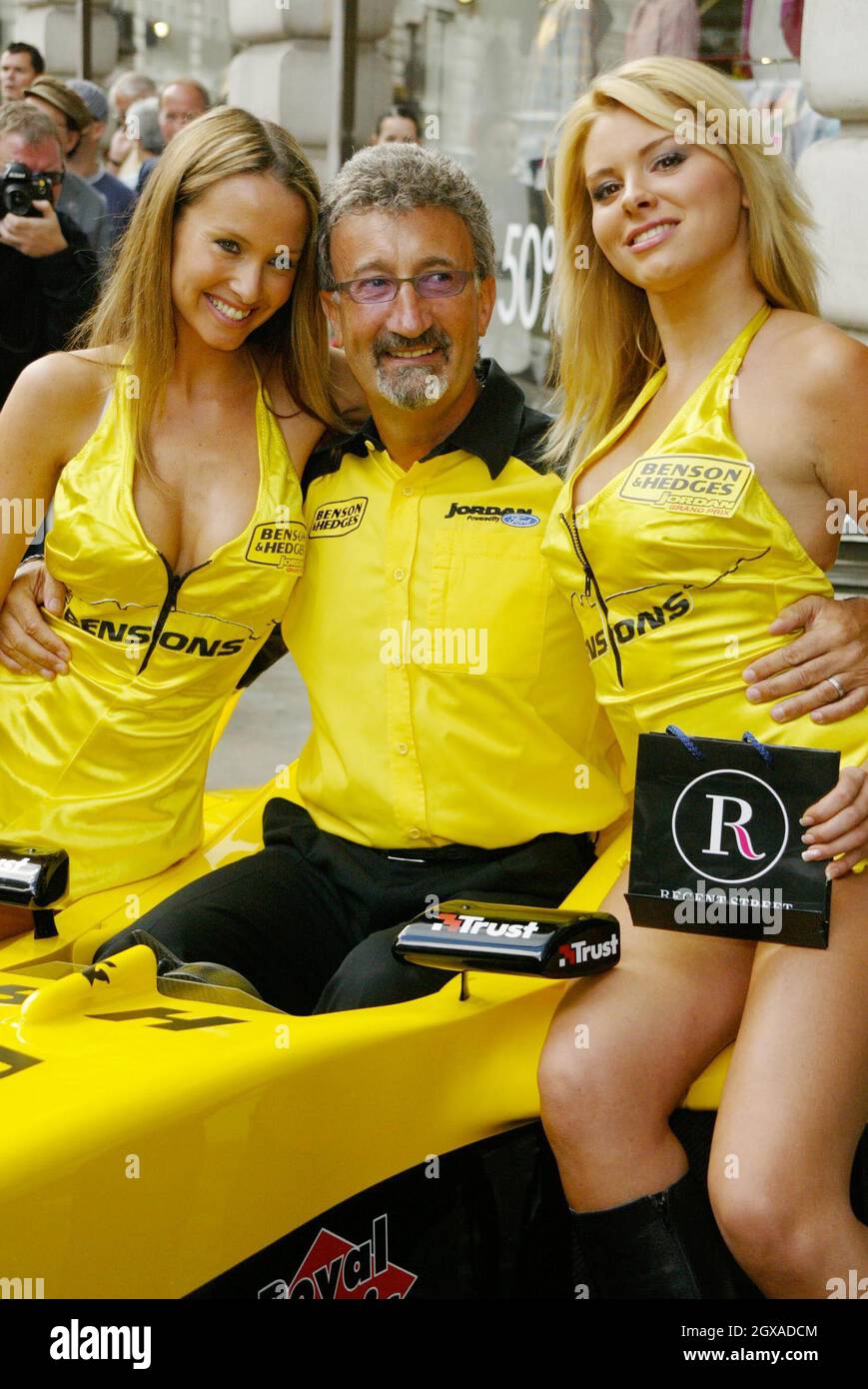 Eddie Jordan with pit babes Michelle Clack (blonde) and Leah Newman (brunette). Together they launched the Regent Street Formula 1 taking place on 060704. The trio, who announced details of the