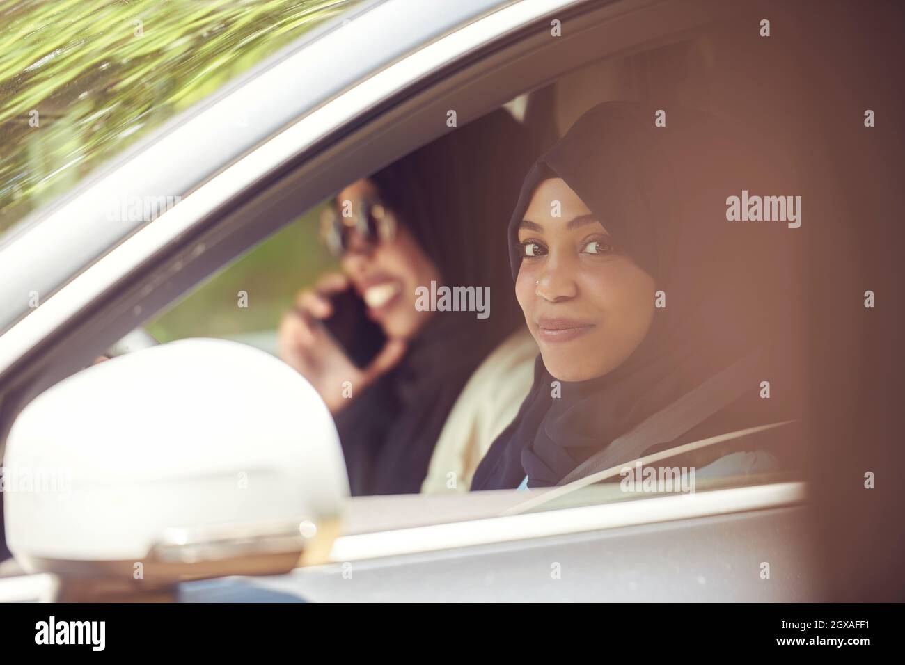 Arabic Woman Couple Traveling By Luxury  Car in Saudy Arabia Stock Photo