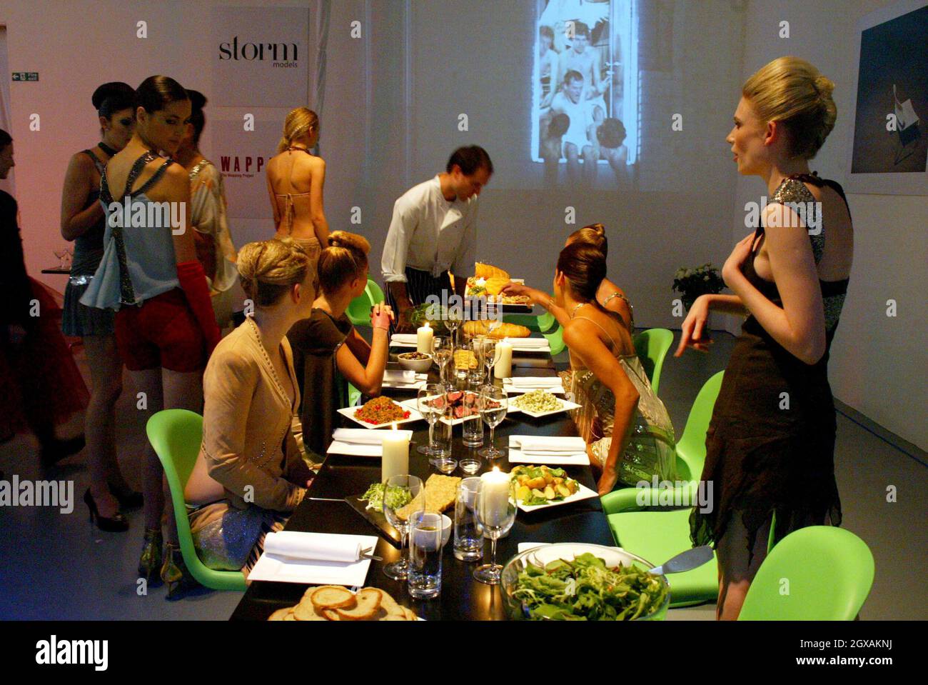To celebrate their inclusion on the Superbrands Cool BrandLeaders list, The Wapping Project, contemporary arts building and restaurant,  invited eight models from the Storm Models agency, dressed in the current cult fashion brand Sass & Bide, to indulge in a renaissance feast. Stock Photo