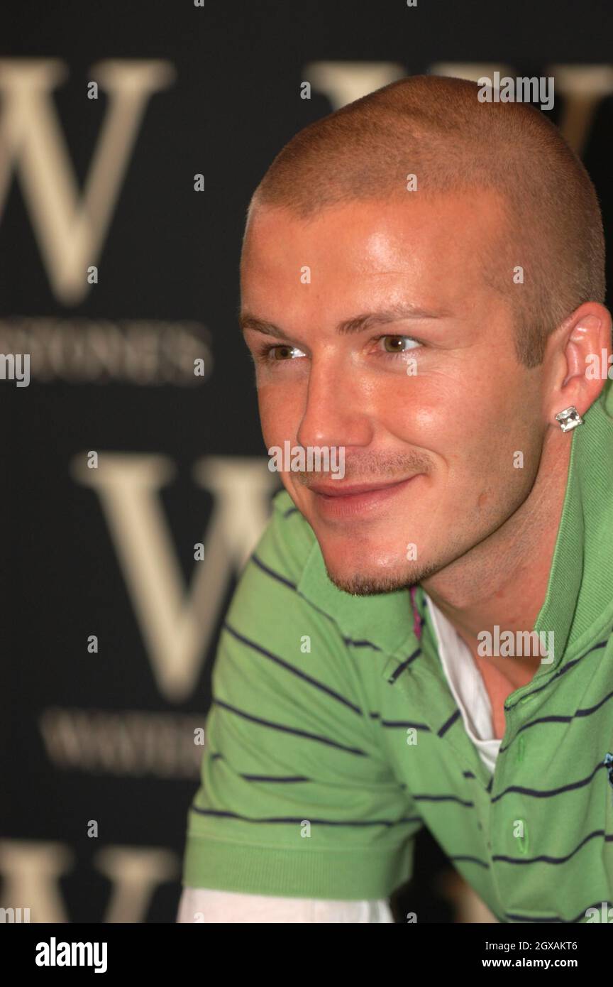 David Beckham singing cpies of his latest autobiography My Side at ...