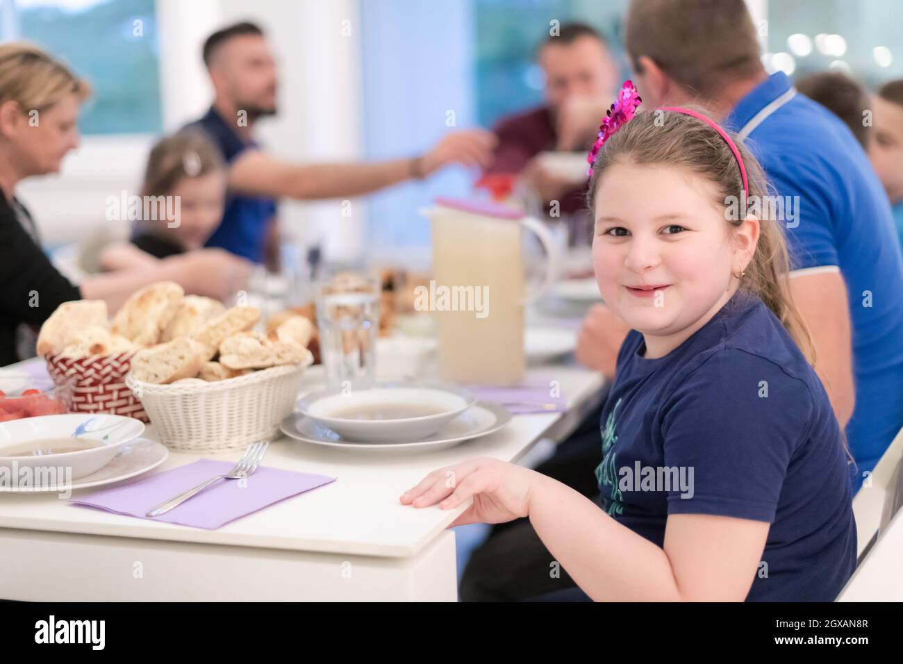 Eid Mubarak Muslim family having Iftar dinner eating dates to break
