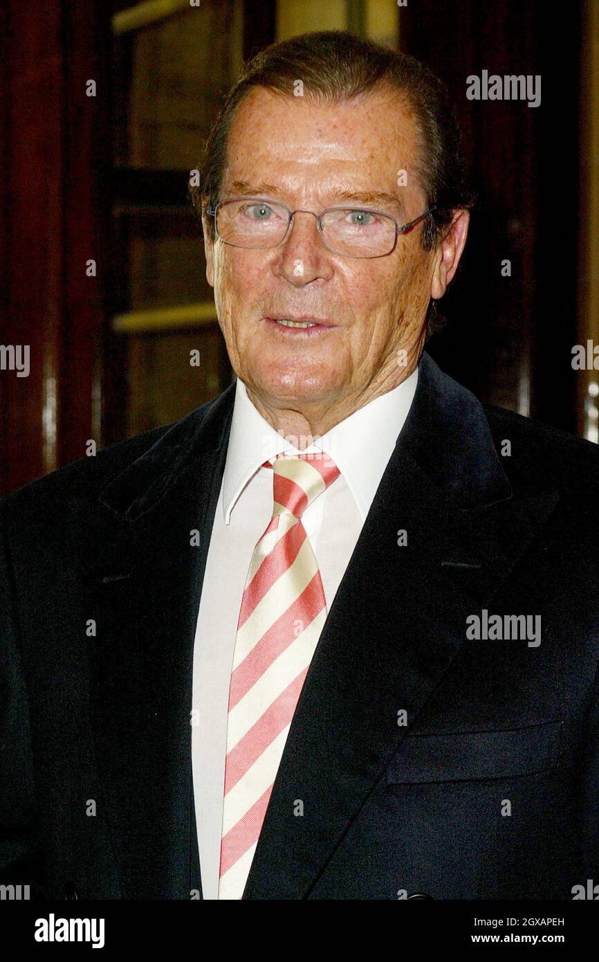 Jack Cardiff and Sir Roger Moore are arriving at the One Whitehall