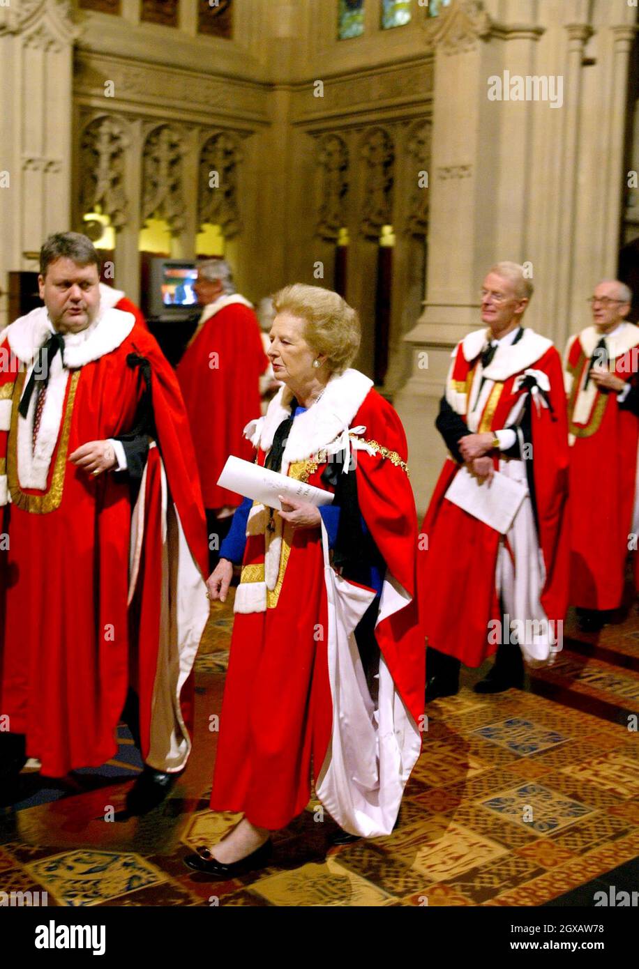 Former British Prime Minister Margaret Thatcher (C) walks through The