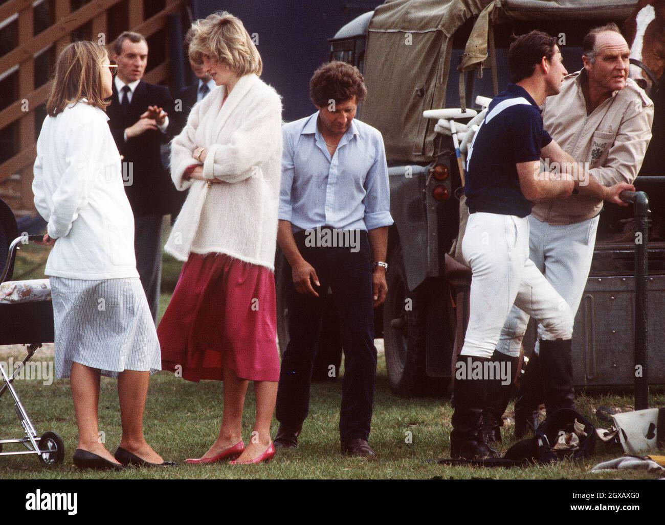 Diana, the Princess of Wales, pregnant with Prince Harry, chats while at a polo event with Prince Charles as bodyguard Barry Mannakee (second from left) looks on in this June1984 file photo in Windsor, England.  A video tape released in the US of Diana speaking in 1992 shows her stating she wanted to run away from Prince Charles and live with  Mannakee. Diana also expresses fears Mannakee was murdered when he died in a motorcycle accident in 1987.    Stock Photo