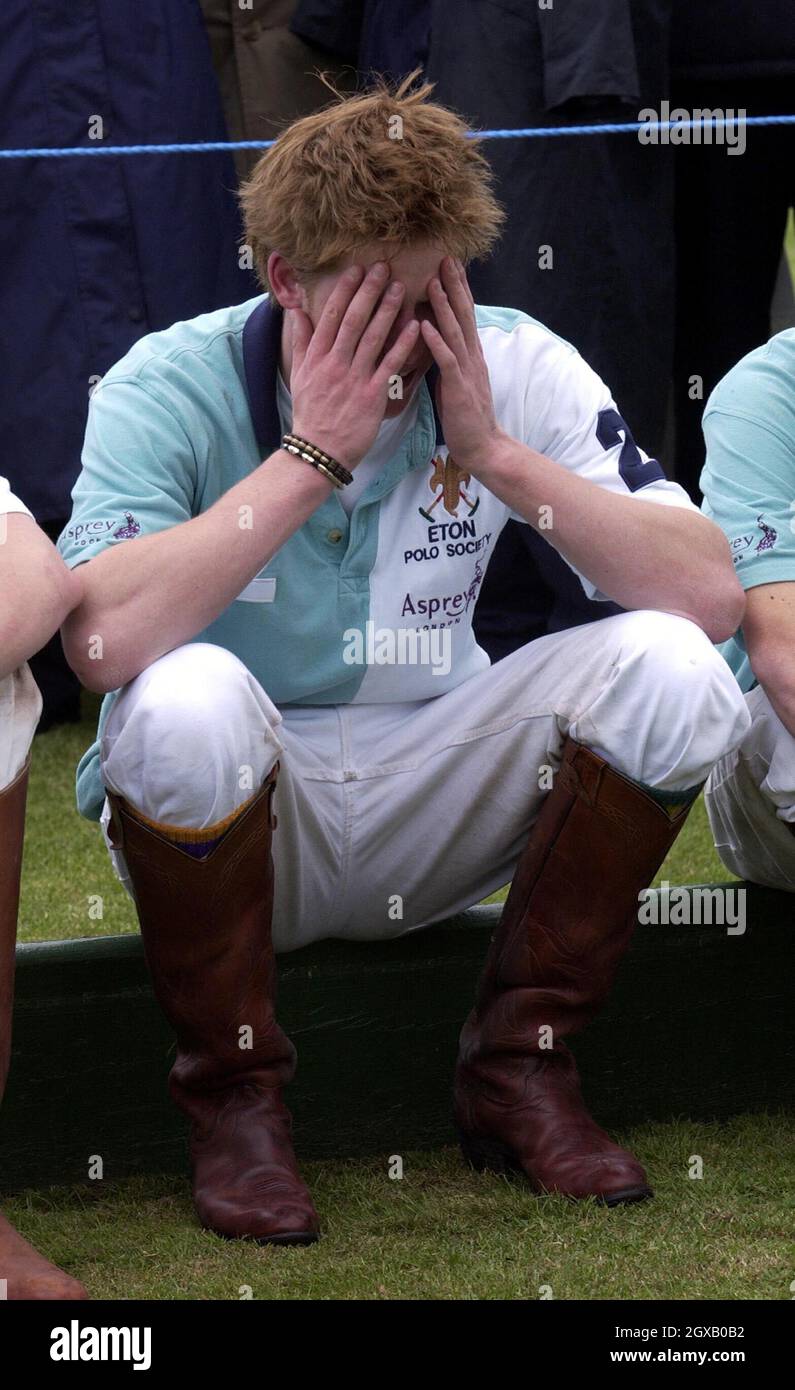 Archive picture of Prince Harry taken at a polo match in May 2003. The 'playboy' prince has made the headlines once again, after attending a fancy dress party  with a nazi swastika on his arm. The lastest scandal follows a succession incidents which have seen the 20 year old prince caught smoking cannabis as a teenager to his more recent nightclub scuffle with a paparazzi photographer. Anwar Hussein/allactiondigital.com   Stock Photo