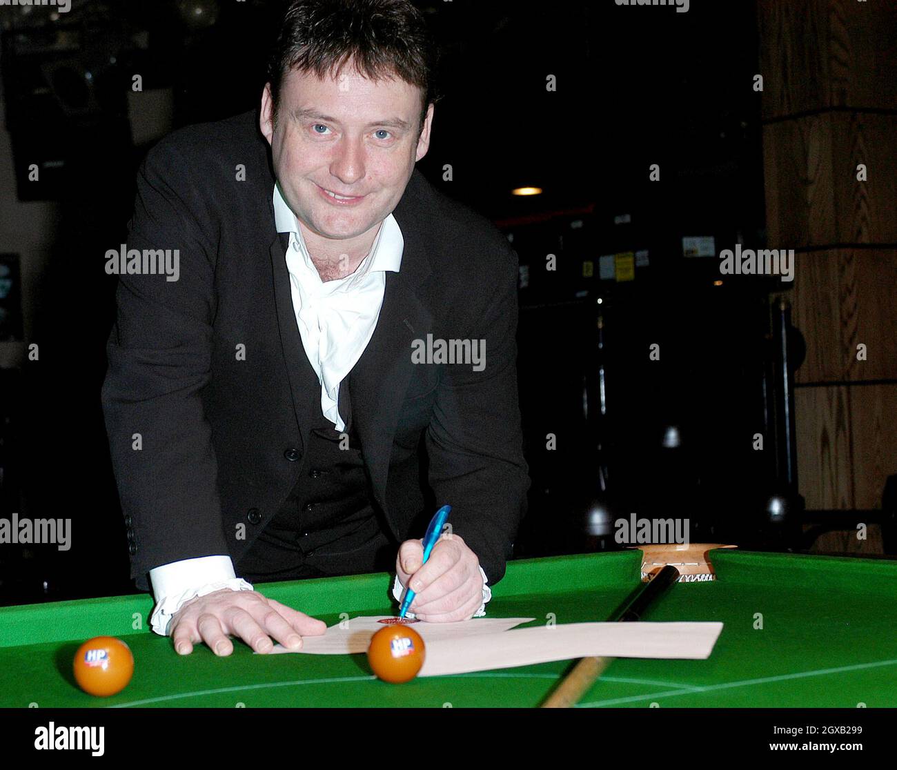 British snooker champions, Jimmy White and Paul Hunter, pose at the Sports Cafe, Haymarket, London on 8 February to celebrate HP's official sponsorship of the brown ball in this year's Masters snooker tournament.  Jimmy White has formally changed his name by deed poll to Jimmy Brown.  Stock Photo