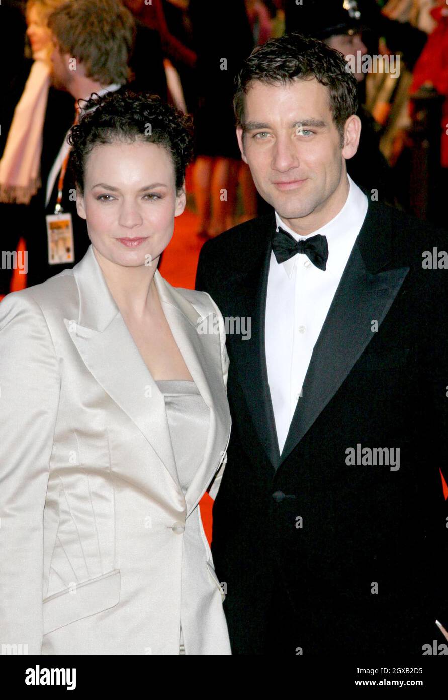 Clive Owen and wife pictured at the  arrivals for the BAFTAS -the British Academy Film Awards at Odeon Leicester Square. Stock Photo