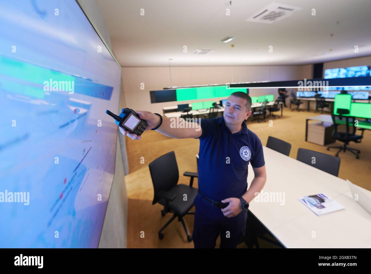 portrait of young male security operator working in a data system ...
