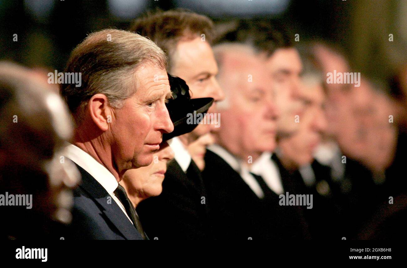 Britain's Prince Charles (L) watches the procession as he is seen beside his partner Camilla Parker-Bowles (2nd L) and Britain's Prime Minister Tony Blair (3rd L) at a service in memory of Pope John Paul II at London's Westminster Cathedral April 4, 2005.  Pope John Paul will be buried in St. Peter's Basilica on April 8, Catholic cardinals decided on Monday as they began to plan the Church's future after the death of the man who led it for a quarter century.  Prince Charles has postponed his marriage to long-time lover Camilla Parker Bowles from Friday to Saturday so that he can attend the fun Stock Photo