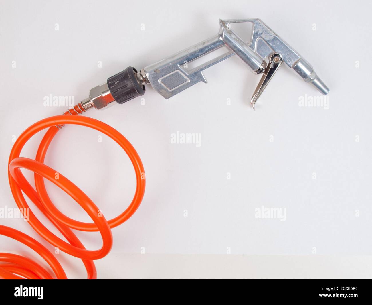 Detail of air compressor hose and pistol. Stock Photo