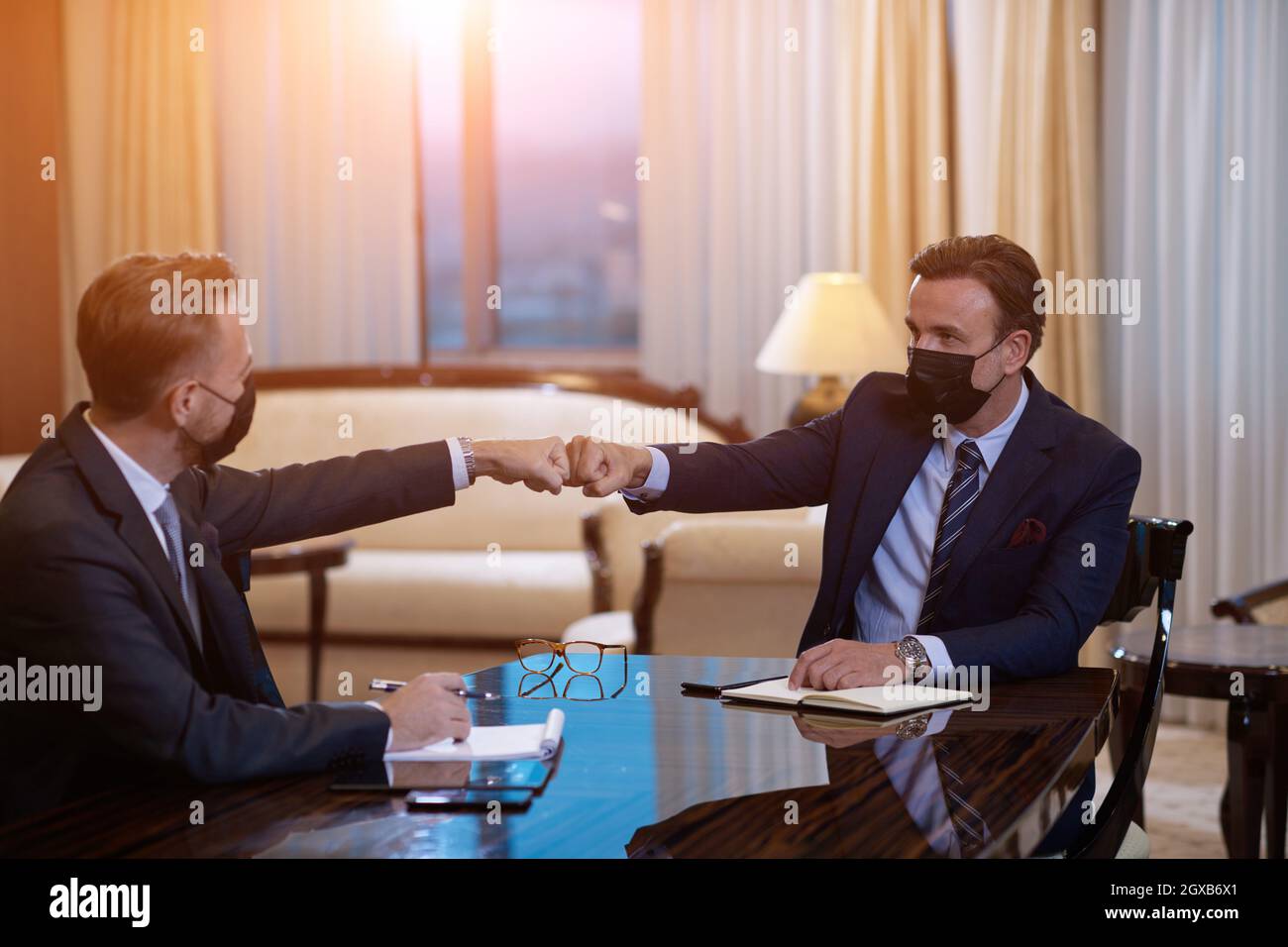 corporate business people on meeting in luxury office wearing crona ...