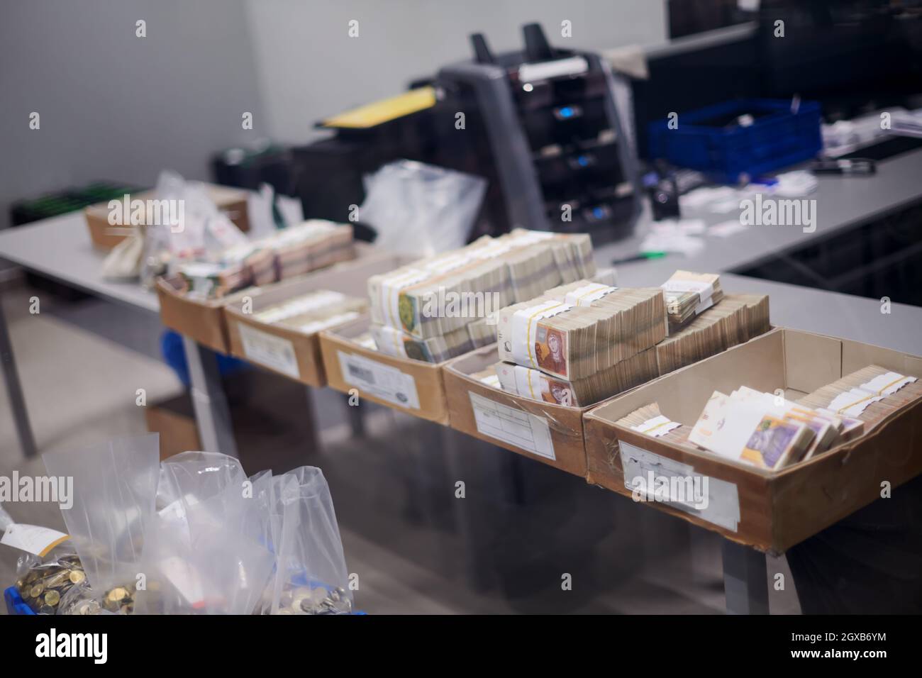 Carton boxes filled with sorted money and stored in the treasury