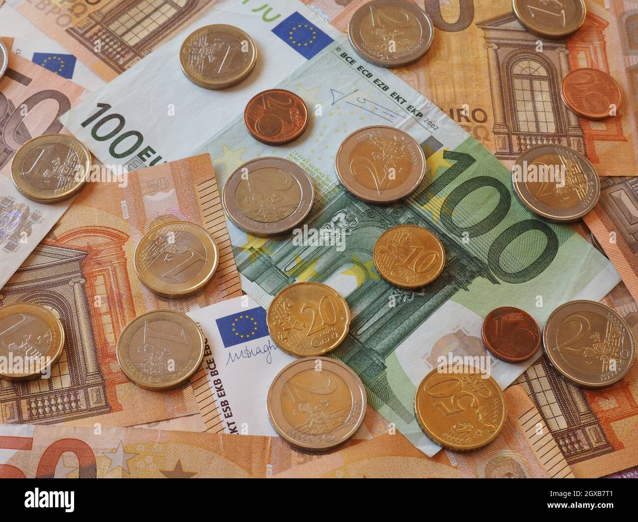 Euro banknotes and coins (EUR), currency of European Union. Stock Photo