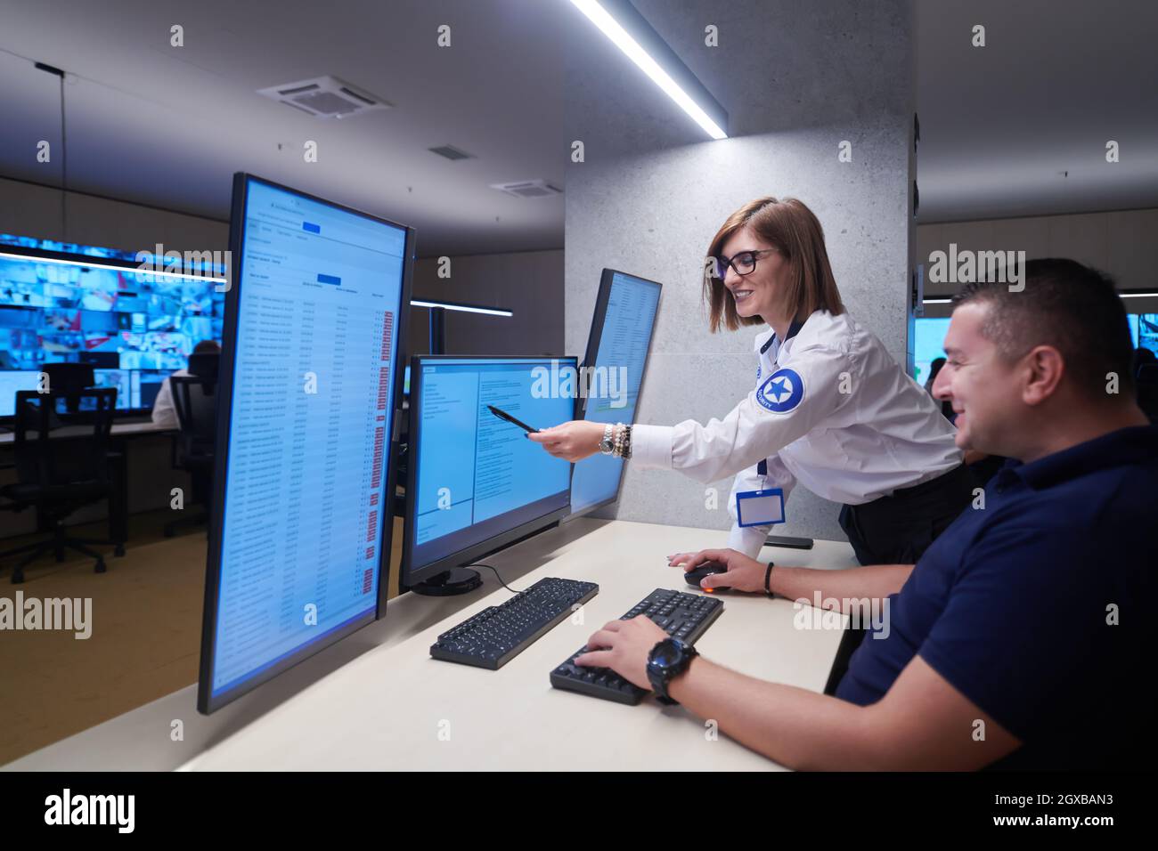 Group of Security data center operators working in a CCTV monitoring ...