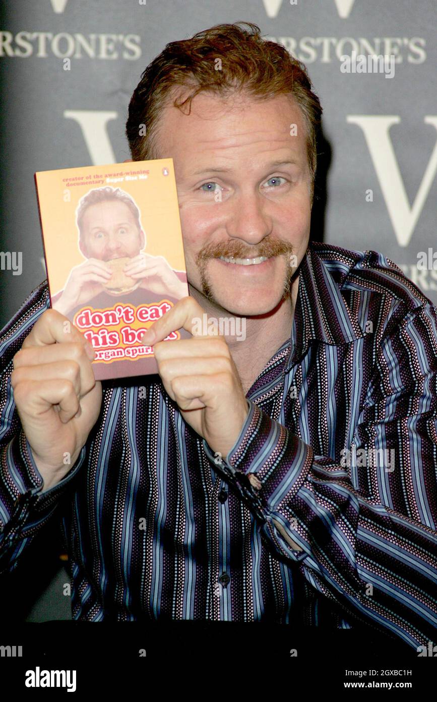 Morgan Spurlock pictured signing copies of his book Don't Eat This Book ...