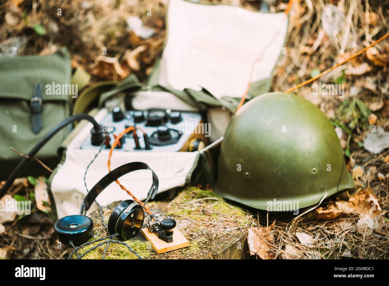 Russian Soviet Portable Radio Transceiver Used By USSR Red Army Signal  Corps In World War Ii. Headphones, Telegraph Key And Helmet Are On A Forest  Stock Photo - Alamy
