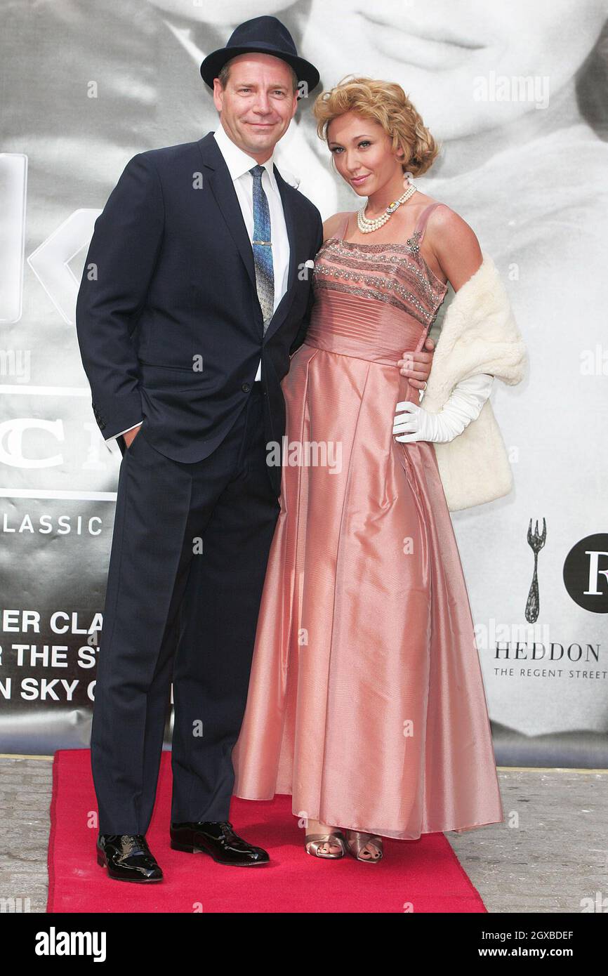 Jenny Frost and  Frank Sinatra look-a-like Stephen Triffitt in costume to look like Grace Kelly and Sinatra in the 1956 movie classic High Society. The event was staged in Soho to promote Sky Classics Film Nights on Heddon Street which start on the 9th of August 2005. Stock Photo