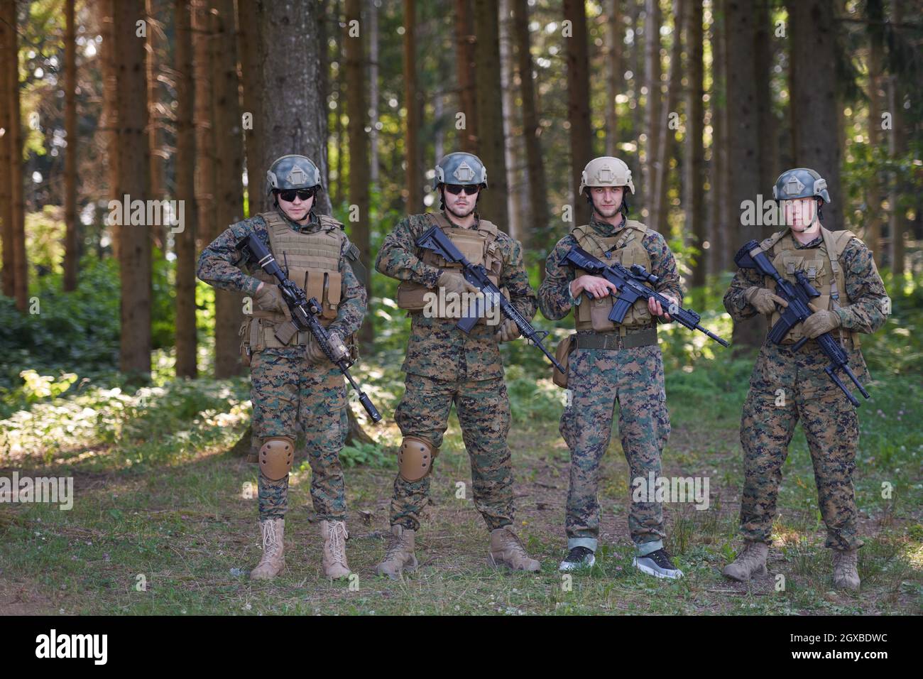 Soldier fighters standing together with guns. Group portrait of US army