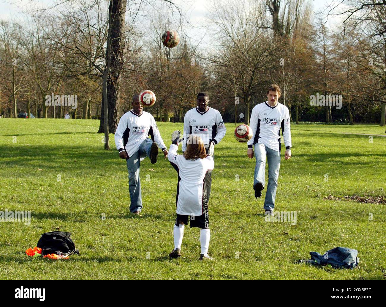 Arsenal's Jens Lehmann (right) and  Kolo Toure (centre) with Fulham's Luis Boa Morte at Jumpers For Goalposts, part of One Amazing Week, in Regent's Park.  The Premiership footballers were drawing attention to LondonÃ•s extensive parklands by taking part in a coaching session for competition-winning children. Stock Photo