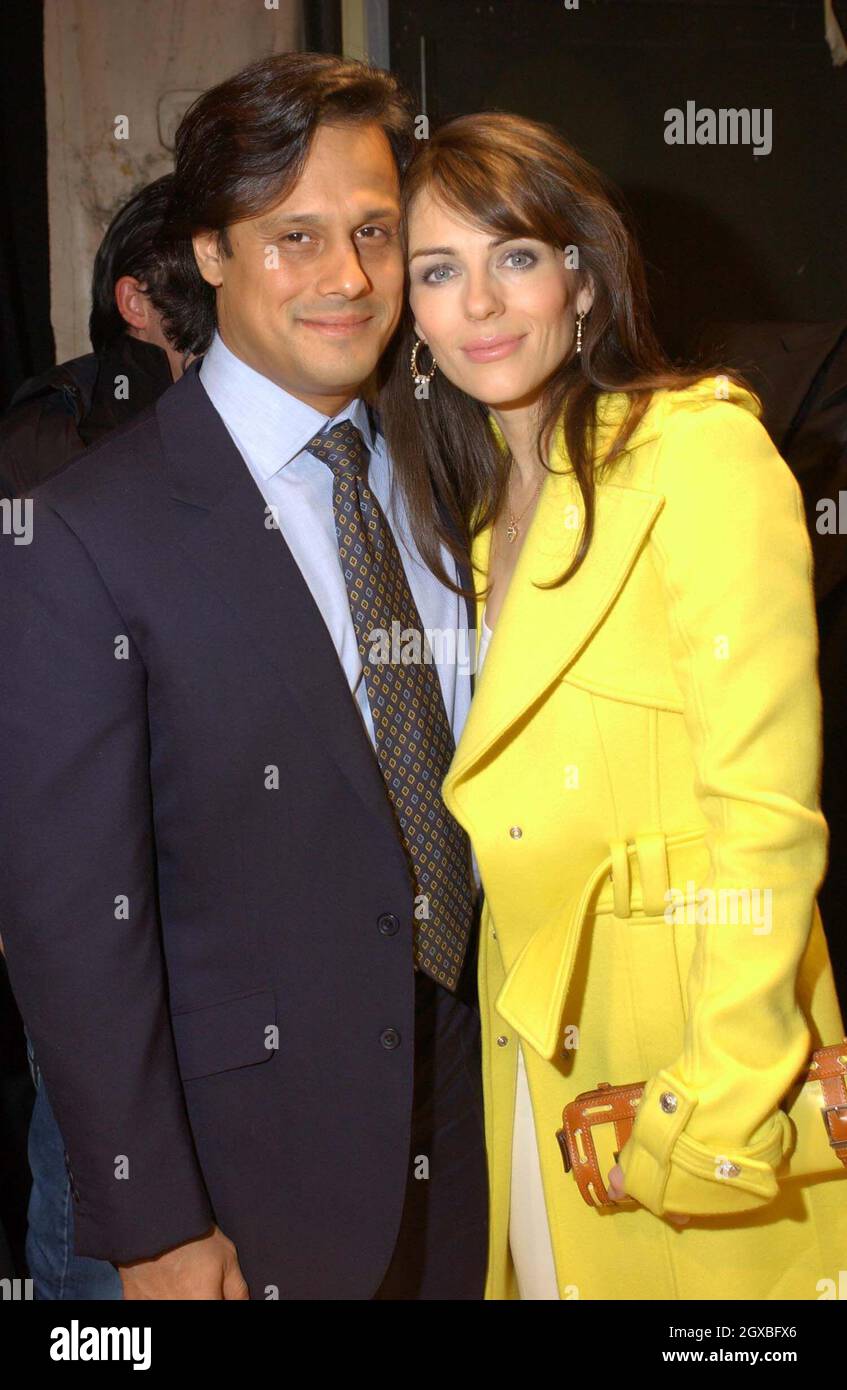 Elizabeth Hurley and boyfriend Arun Nayar Backstage at The Versace Fashion Show 2004/2005 for Milan Fashion Week.  Stock Photo