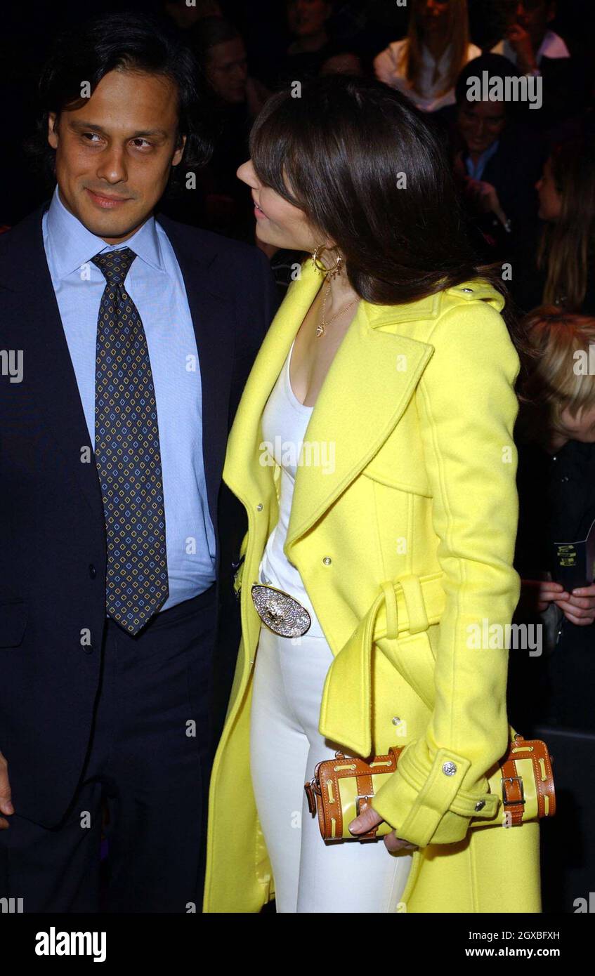 Elizabeth Hurley and boyfriend Arun Nayar at The Versace Fashion Show 2004/2005 for Milan Fashion Week.  Stock Photo