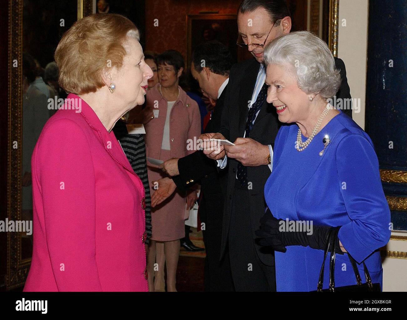 Britain's Queen Elizabeth II talks with former Prime Minister Baroness Thatcher  at the Reception and Lunch for Women Achievers held  at Buckingham Palace in London .  Stock Photo