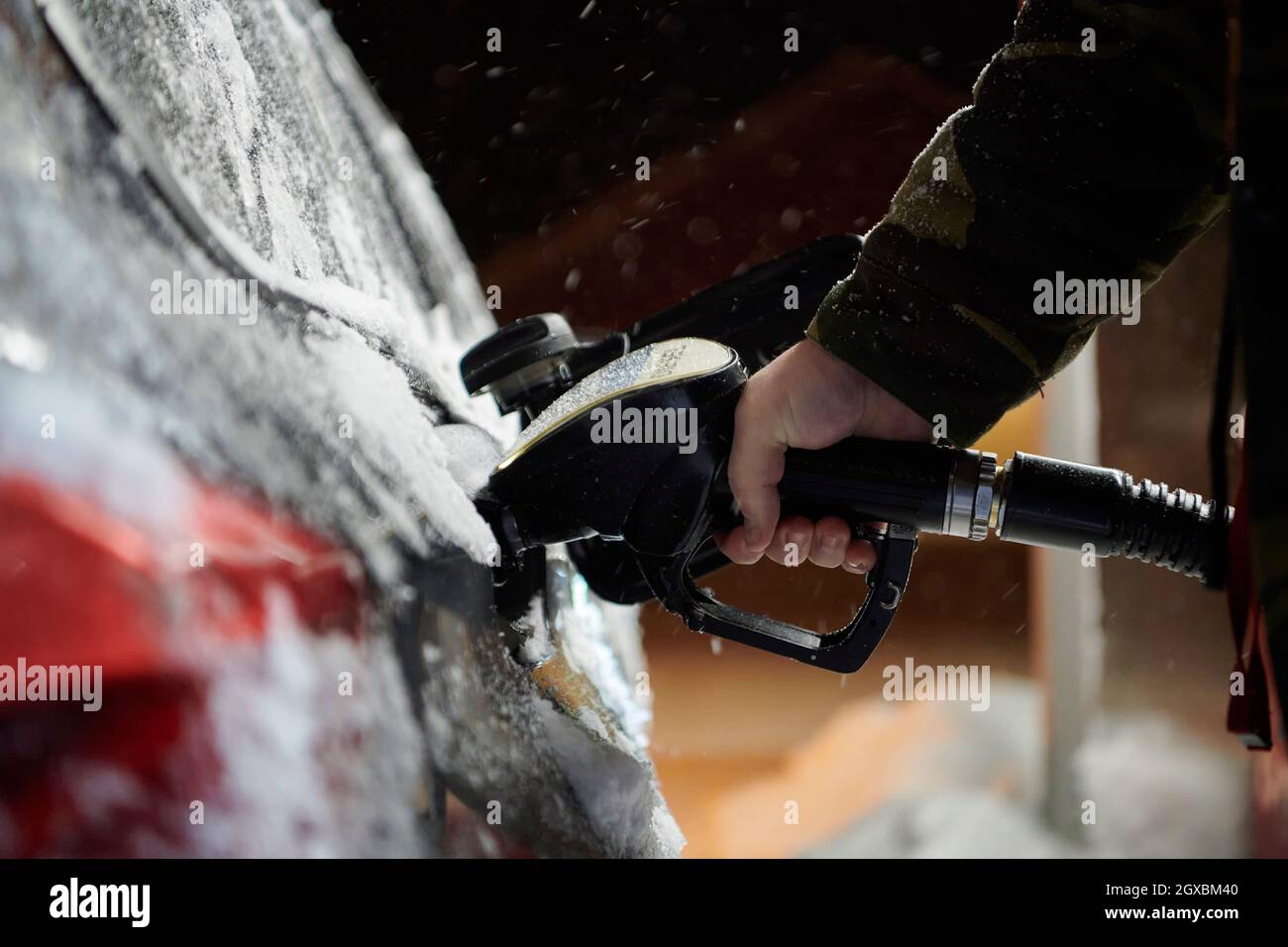 refuelling diesel gas on petrol station on cold winter night Stock