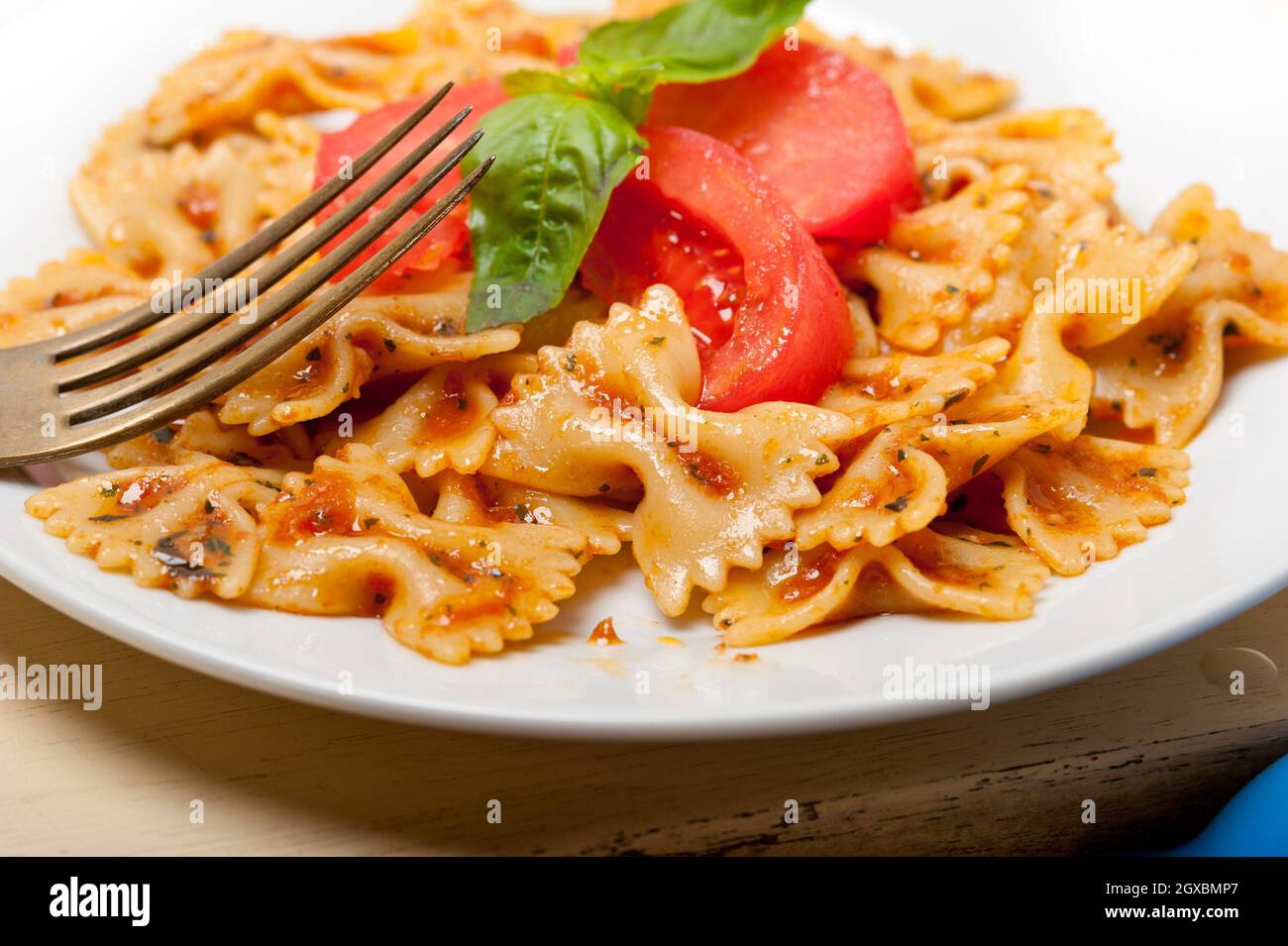 Italian pasta farfalle butterfly bowtie with tomato basil sauce over